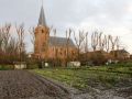 Hantum   volkstuintjes met kerk op de achtergrond
